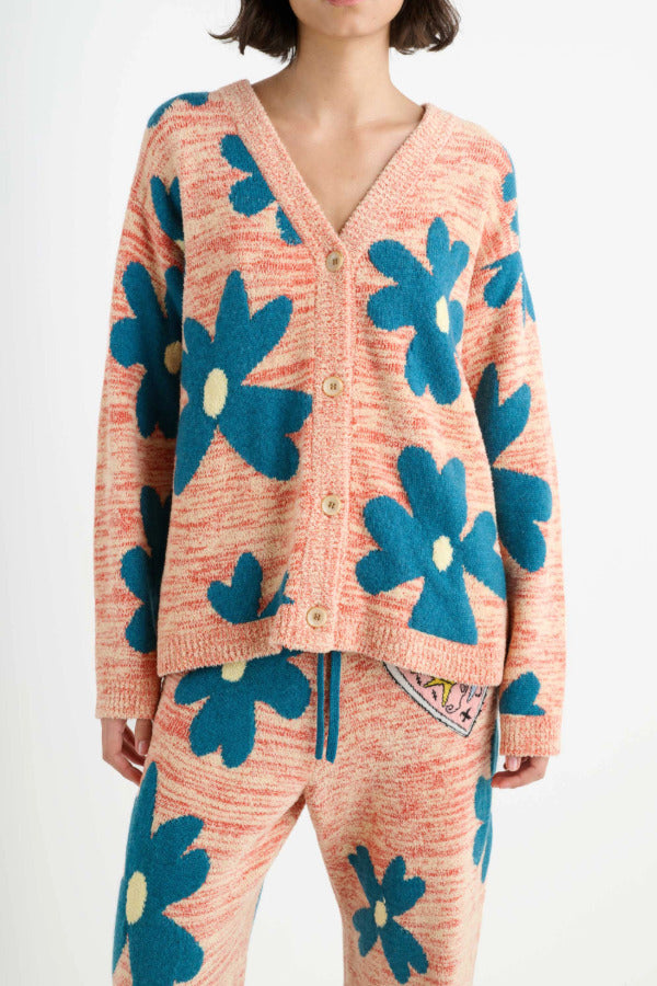 Front closeup view of multi floral the elder statesman sun and moon cardigan on model wearing matching pants, against white background