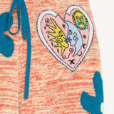 Front closeup view of multi floral drawstring pants on a white background, with no model shown.