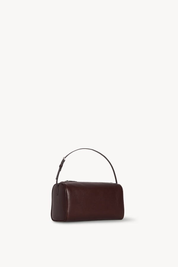 Front slanted view of burgundy 90's bag on white background, with no model shown.