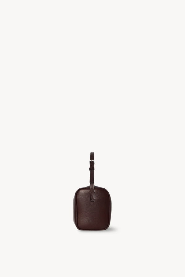 Side view of burgundy 90's bag on white background, with no model shown.