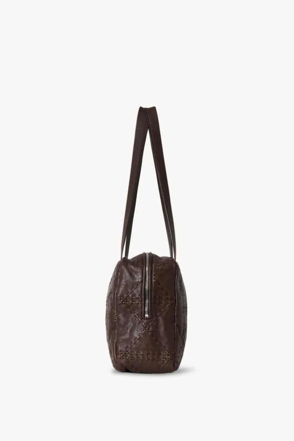Side view of brown astra bowling bag on white background, with no model shown.