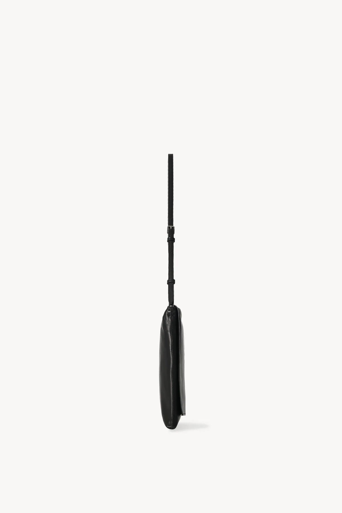 Side view of black leather bag on white background, with no model shown.