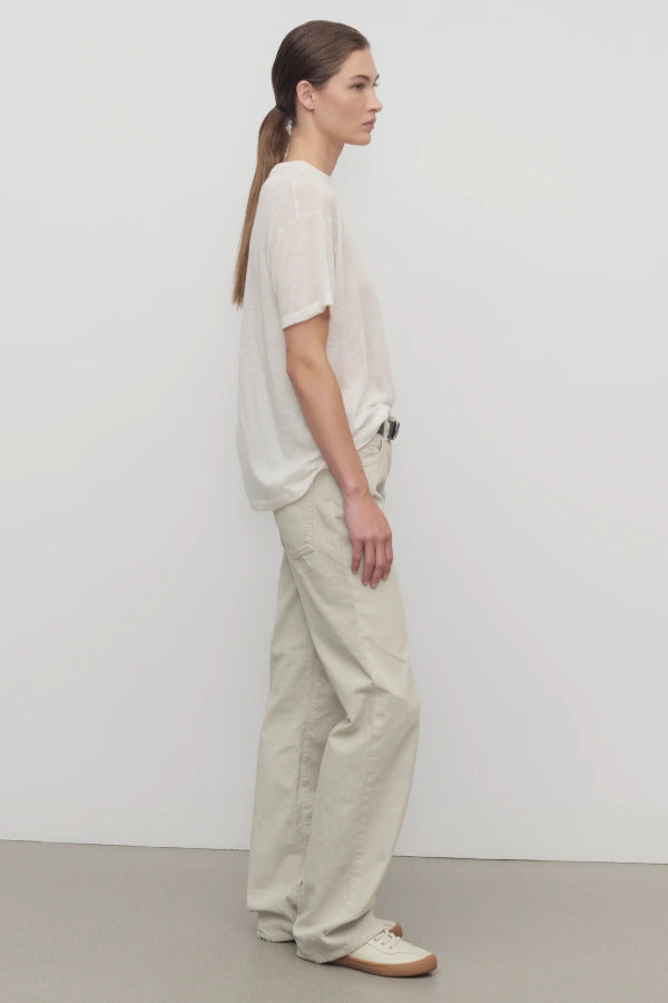 Side view of ice carlyl pant on model wearing white t-shirt and sneakers, against a white background.