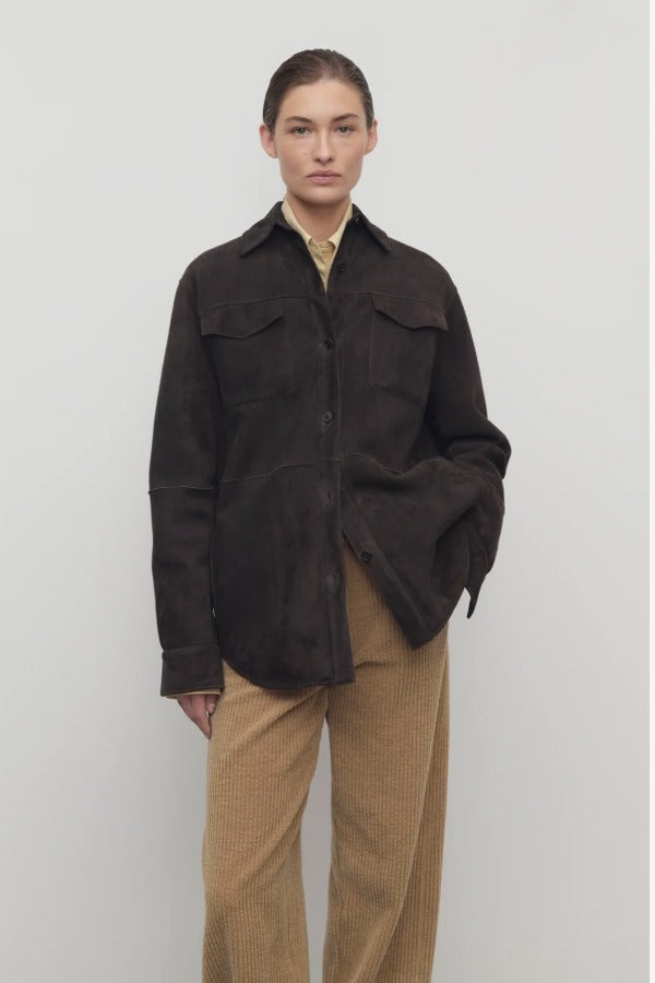 Front view of dark brown gwena jacket on model wearing khaki pants, against a white background.