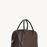 Front slanted view of deep brown india 12 bag on white background, with no model shown.