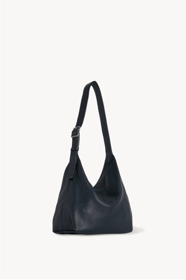 Front slanted view of blu notte isa shoulder bag on white background, with no model shown.