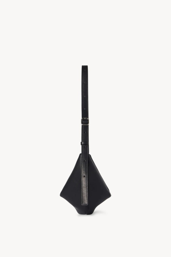 Side view of black jouvette bag on white background, with no model shown.