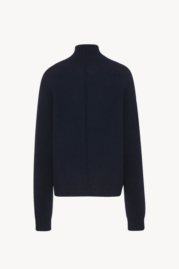Back view of dark navy kensington top on white background, with no model shown.