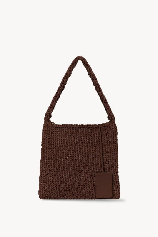 Back view of brown large didion bag on white background, with no model shown.