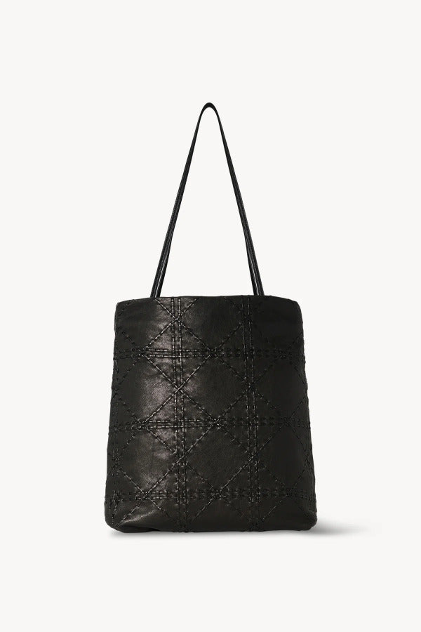 Front view of black lilou woven tote on white background, with no model shown.