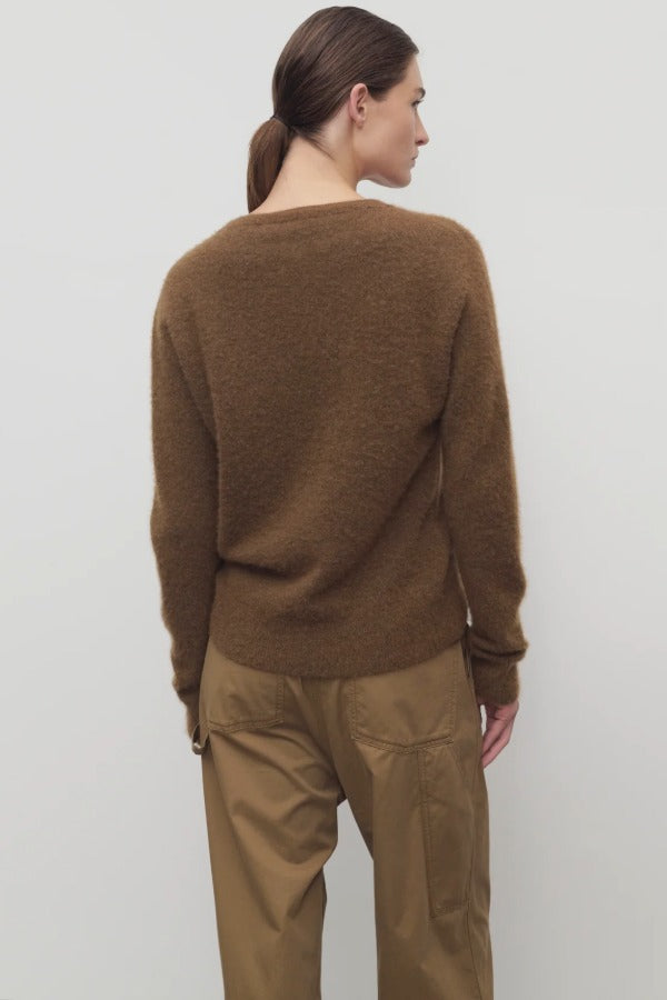 Back view of oak lorynna top on model wearing camel trousers, against a white abckground.