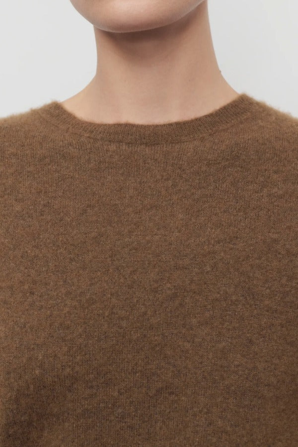 Front closeup of oak lorynna top on model against a white background.