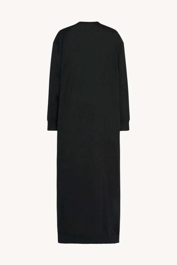 Back view of black luza dress on white background, with no model shown.