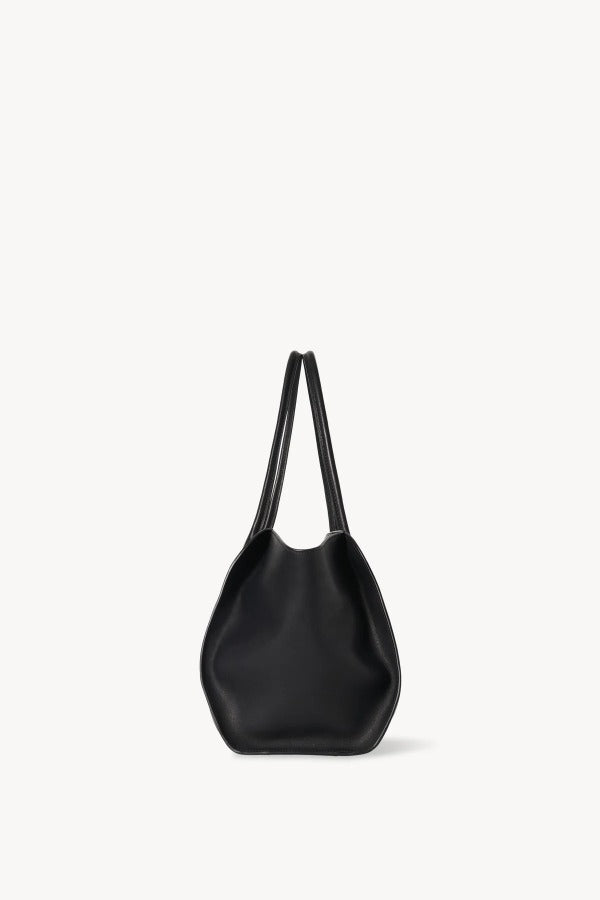 Side view of black marlo 14 bag on white background, with no model shown.