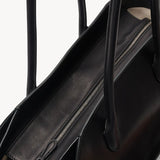 Zipper view of black marlo 14 bag on white background, with no model shown.