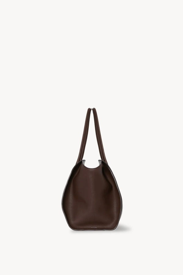Side view of deep brown marlo 14 bag on white background, with no model shown.