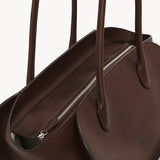 Zipper view of deep brown marlo 14 bag on white background, with no model shown.