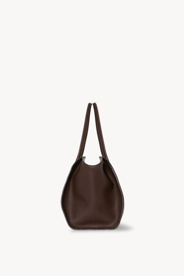 Side view of deep brown marlo 14 bag on white background, with no model shown.