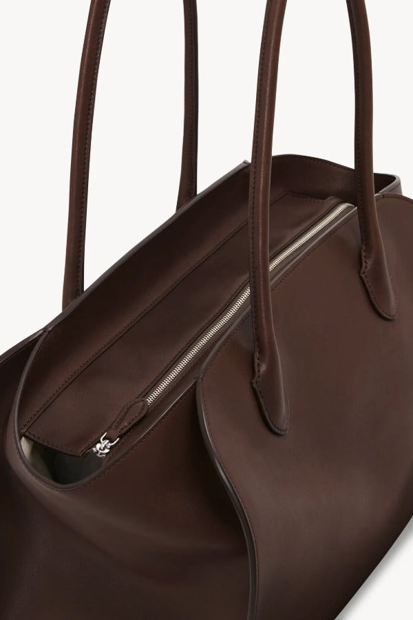Inside zip view of deep brown marlo 14 bag on white background, with no model shown.