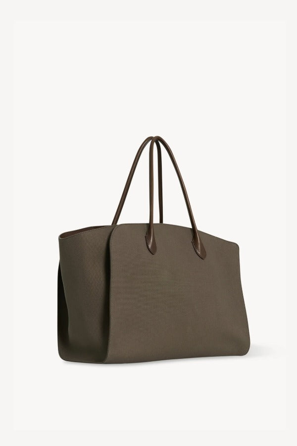 Front slanted view of taupe marlo 17 bag on white background, with no model shown.