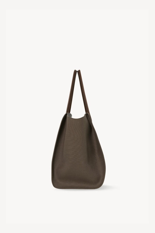 Side view of taupe marlo 17 bag on white background, with no model shown.