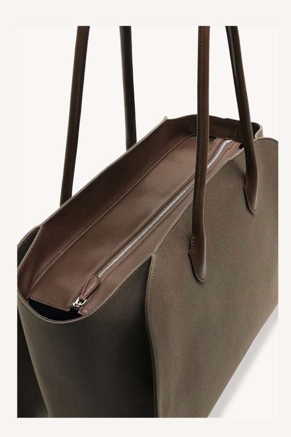 Zipper view of taupe marlo 17 bag on white background, with no model shown.