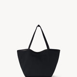 Front view of black park tote three canvas on white background, with no model shown.