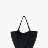 Back side view of black park tote three canvas on white background, with no model shown.