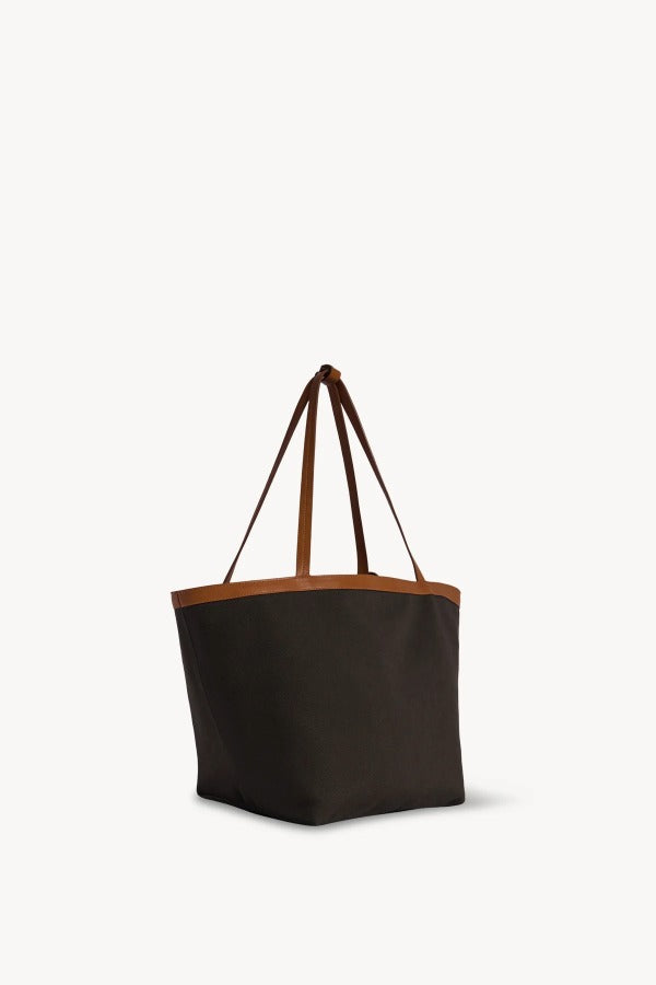 Front slanted view of brown park tote three canvas on white background, with no model shown.