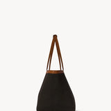 Side view of brown park tote three canvas on white background, with no model shown.