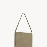 Side slanted view of Sage Nan Shoulder Bag on white background, with no model shown.