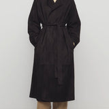 Front view of dark brown solana coat on model wearing khaki pants and mules, against a white background.