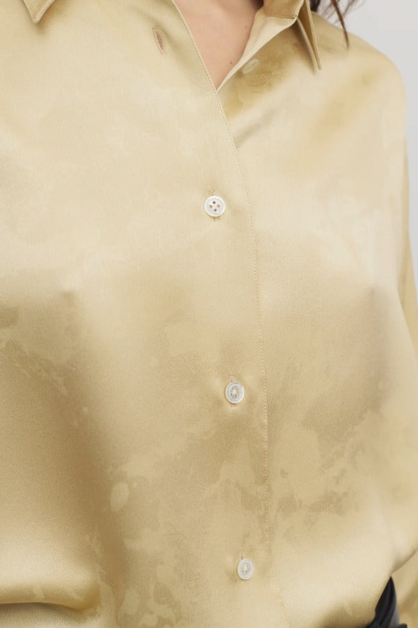 Front closeup view of sand takara shirt on model, against a white background.