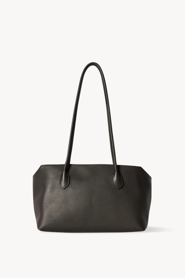 Front view of dark brown terrasse bag on white background, with no model shown.