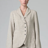 Front view of chalk herringbone jacket on model wearing chalk pants, against a grey background.