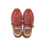 Overhead view of red fkt runner sneaker on white background, with no model shown.