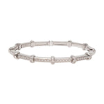 Front view of 18k white gold spring bracelet on white background with no model shown.