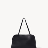 The Row Peggy Clutch in Saddle Leather