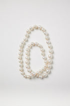 White Baroque Pearl Strand on Pink String