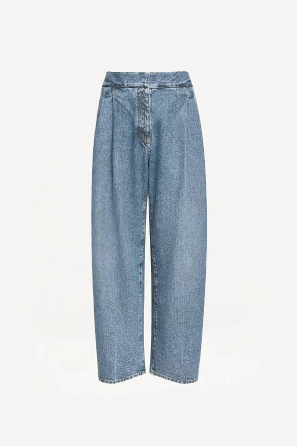 Front view of bleu delave pleated pants on white background with no model shown.