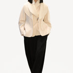 Front view of ivory aislinn knit jacket on model wearing black trousers, against a white background.