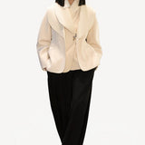Front view of ivory aislinn knit jacket on model wearing black trousers, against a white background.