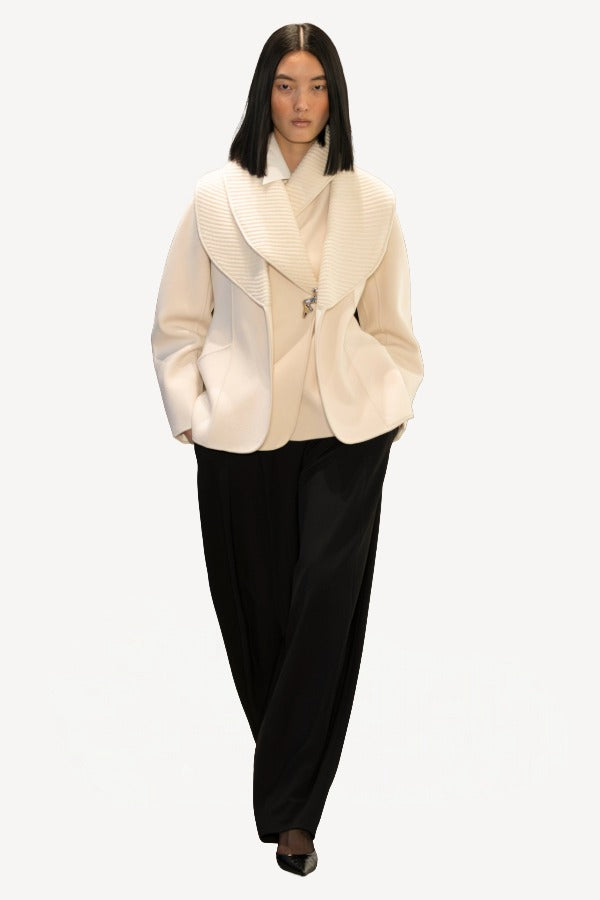 Front view of ivory aislinn knit jacket on model wearing black trousers, against a white background.