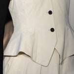 Front closeup of ivory william vest on model wearing ivory trousers, against a white background.
