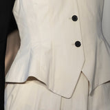 Front closeup of ivory william vest on model wearing ivory trousers, against a white background.