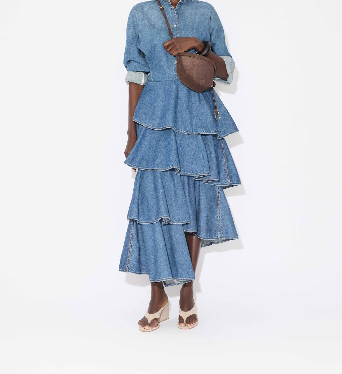 Front view of bleu mineral spiral skirt on model wearing denim top and natural sandals, against a white background.