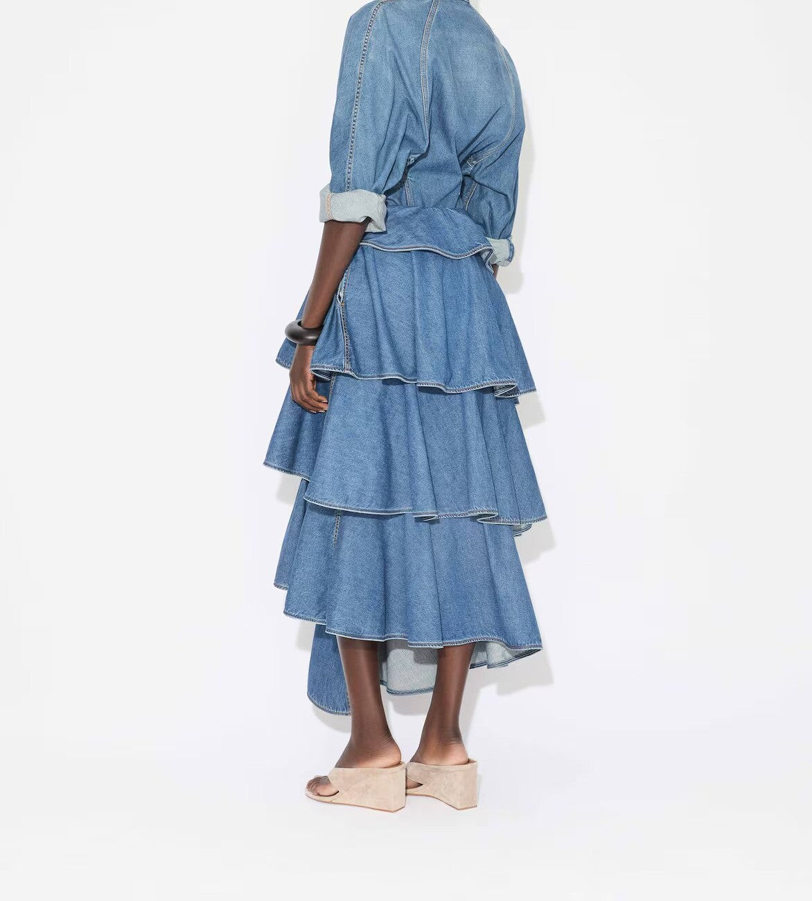 Back view of bleu mineral spiral skirt on model wearing denim top and natural sandals, against a white background