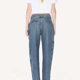 Back view of blanc cropped t-shirt on model wearing jeans and heels, against a white background.