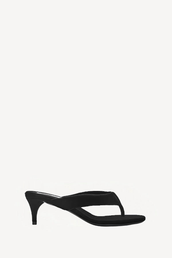 Right side view of noir heel thong mule in velvet on white background, with no model shown.