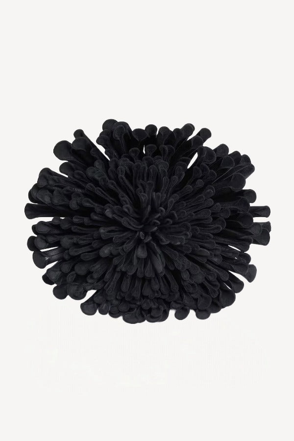 Front view of noir leather flower choker on white background, with no model shown.